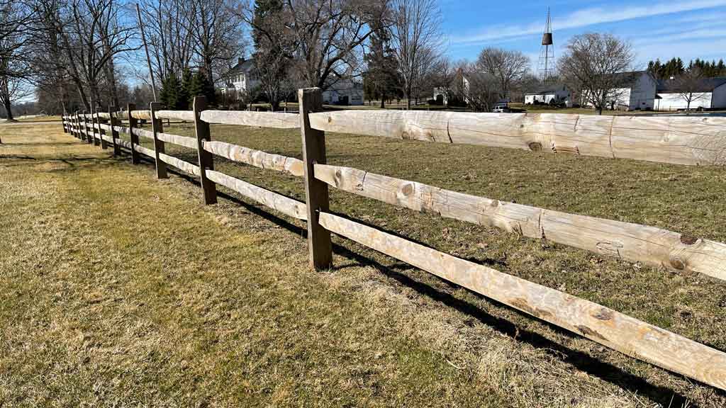 Split rail fence with 3 rails