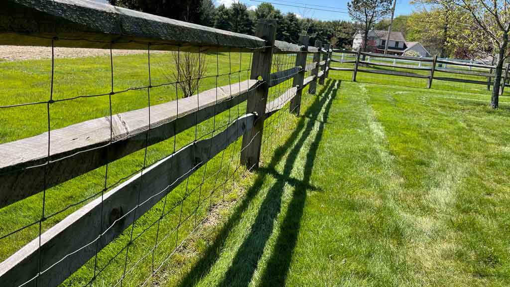 woven wire mesh on split rail fence