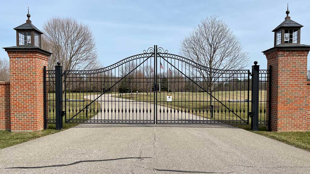 wrought iron estate gate across driveway