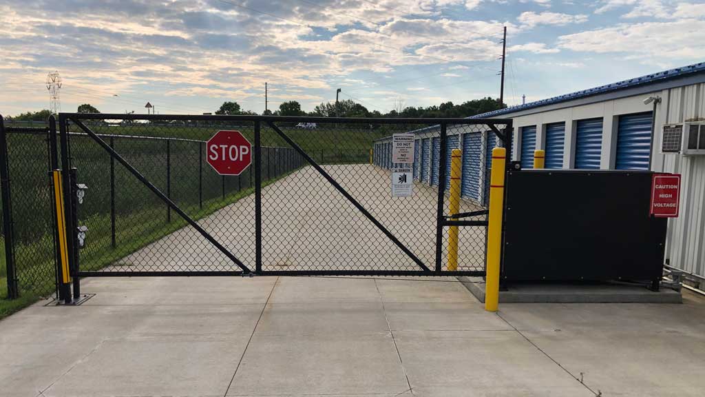 Chain link lift gate across driveway