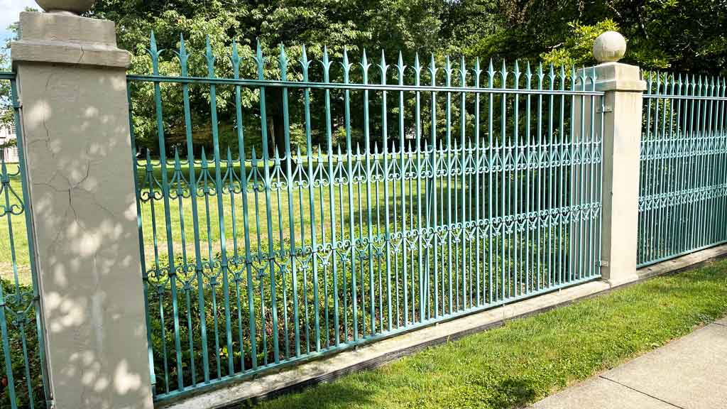 green iron fence