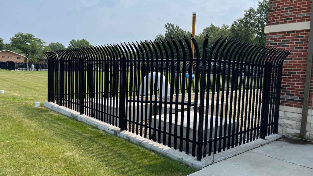 fenced enclosure using palisade metal fence