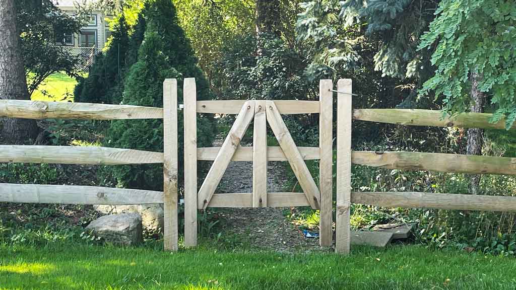 gate in split rail fence