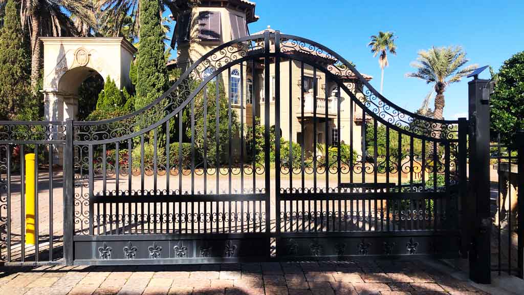 very ornate wrought iron estate gate