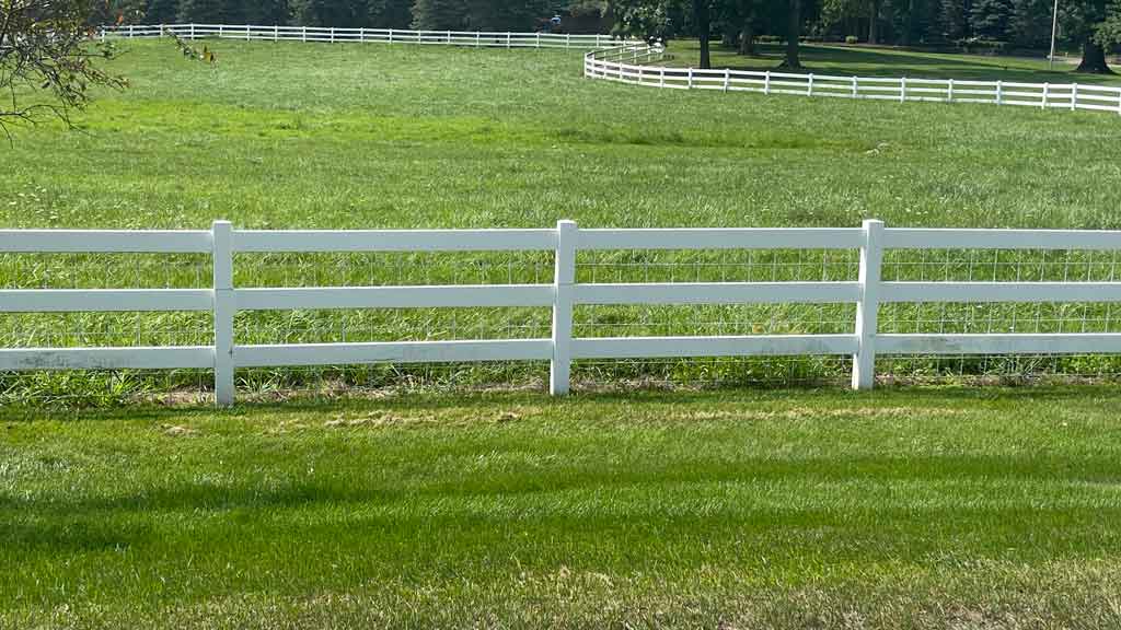 White vinyl post and rail fencing