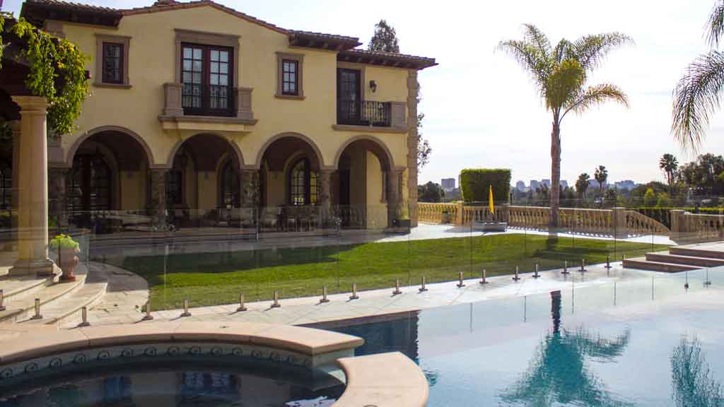 glass pool fencing on pool deck