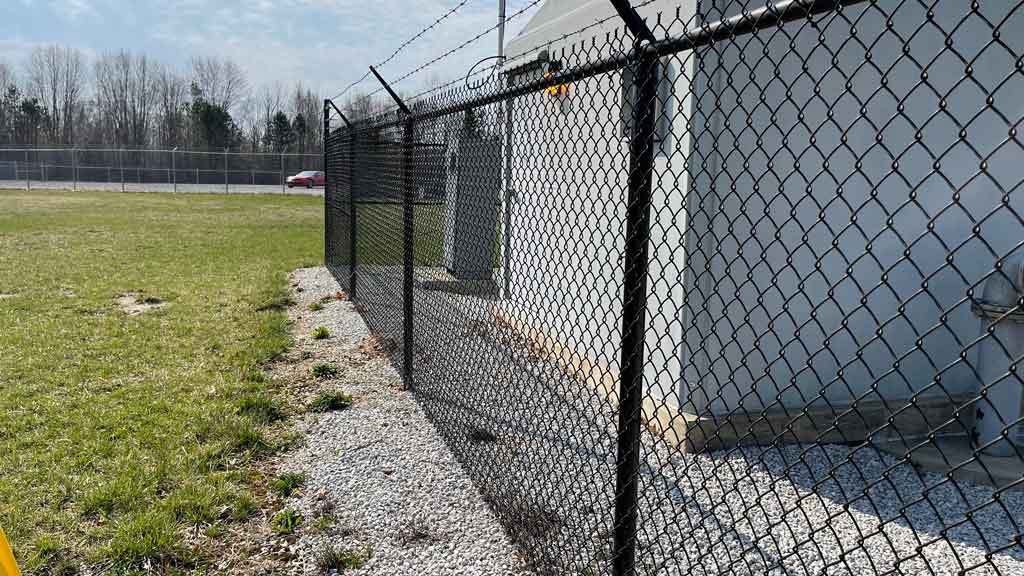 black chain link mesh on commercial fence