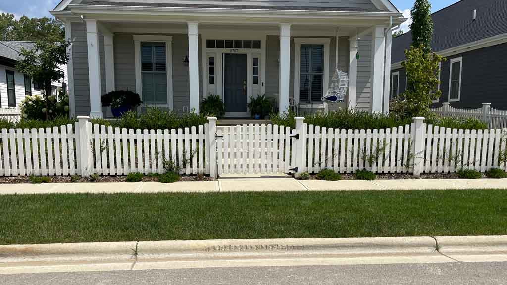 white scalloped picket fence