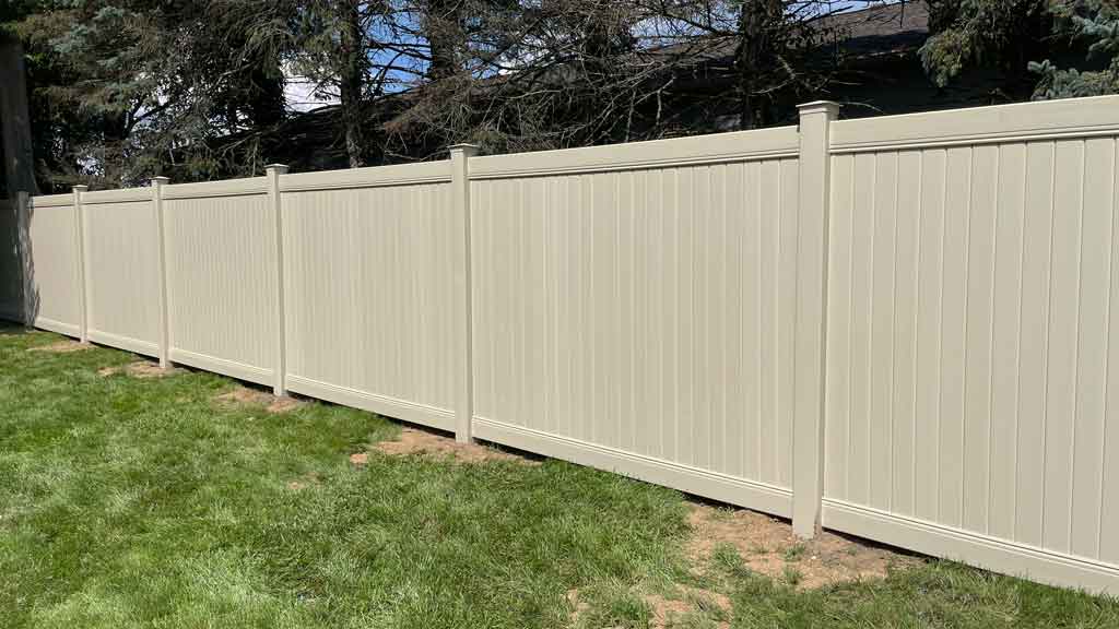 Solid tan vinyl fence