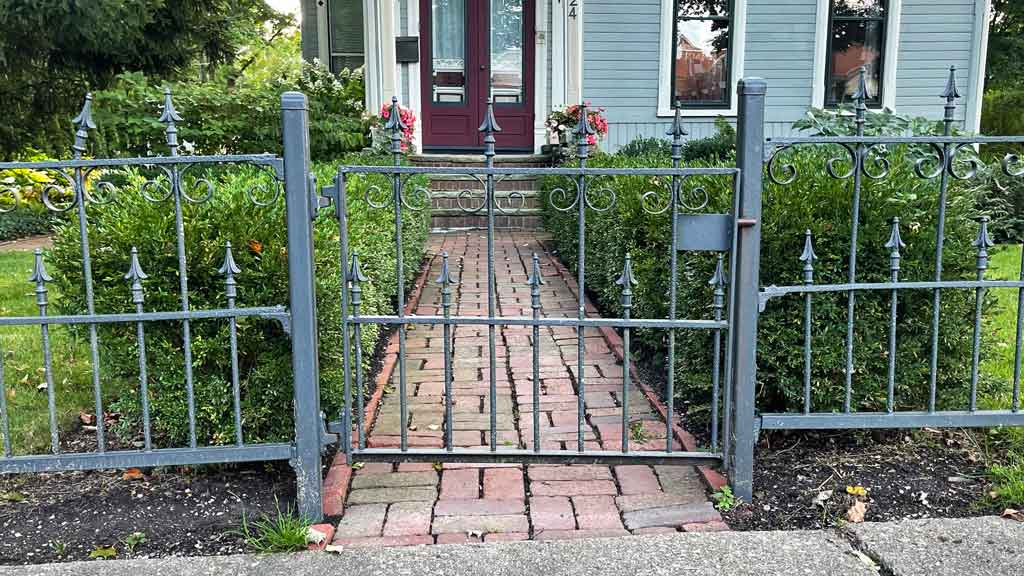 Iron gate over a sidewalk