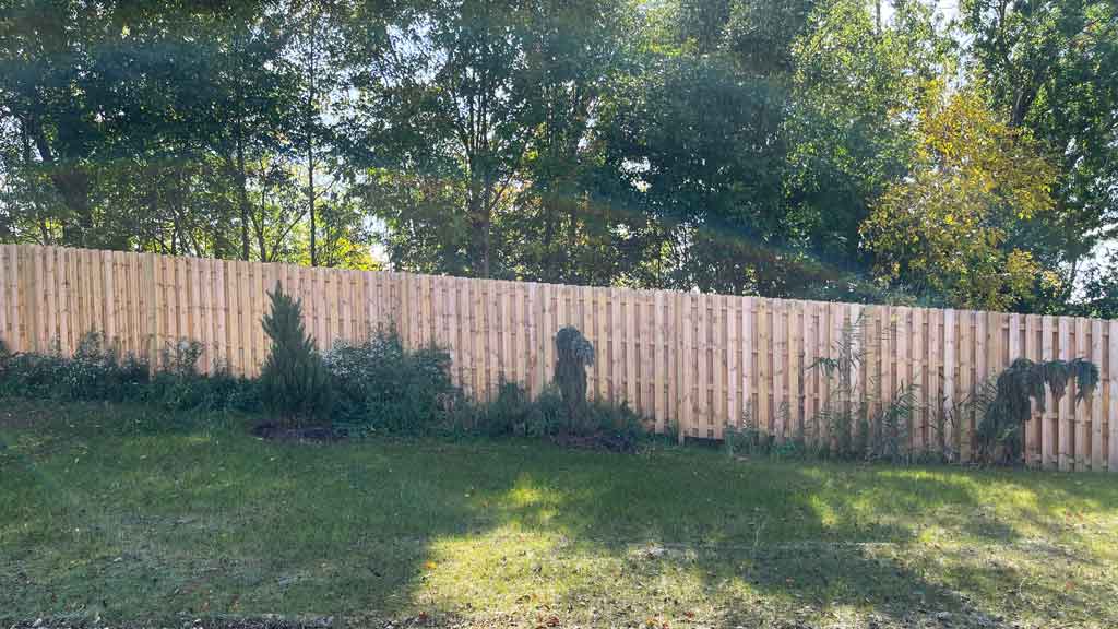 wood fence built on a slope