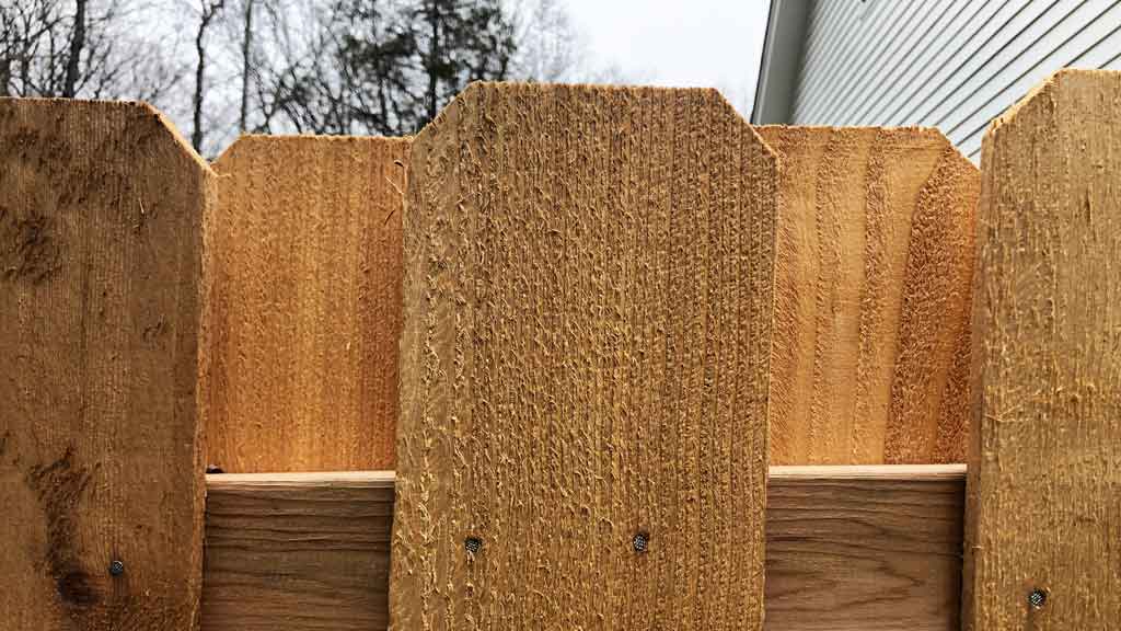 close up of dog ear cedar picket