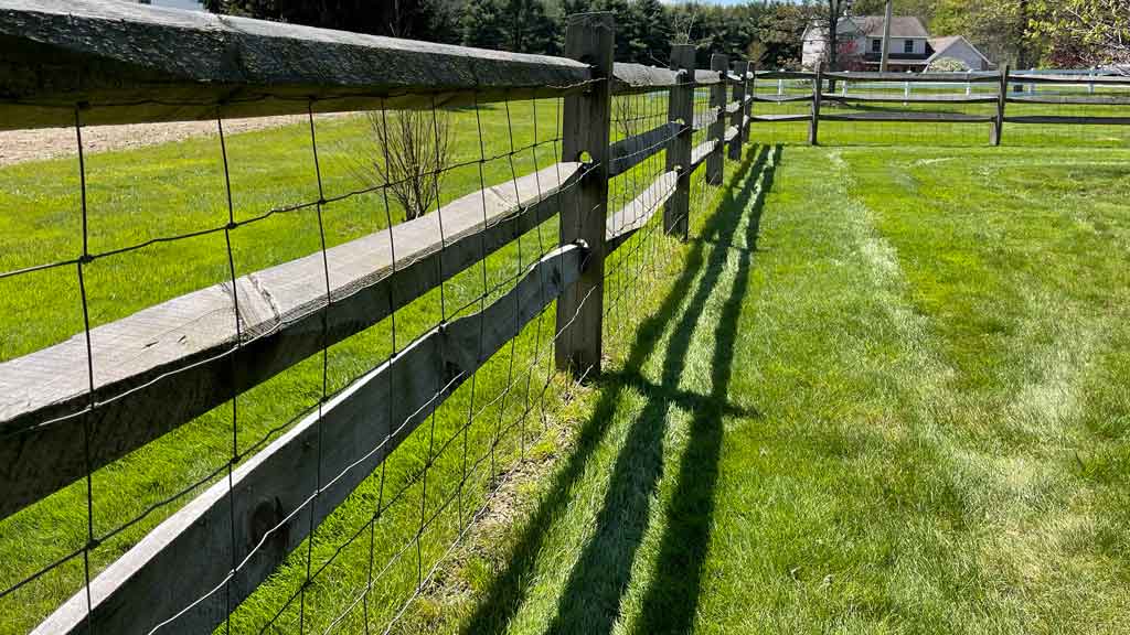 woven wire mesh on split rail fence