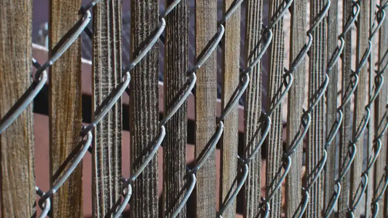 wooden privacy slats in chain link fence